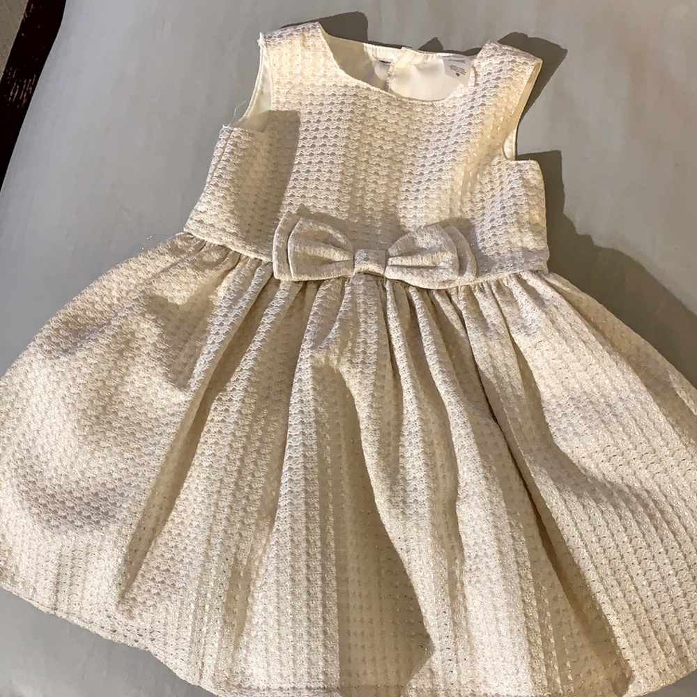 Girls cream and gold fancy dress from Carter’s